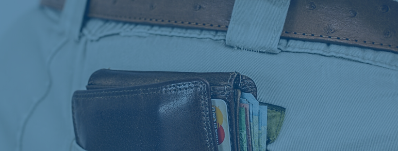 wallet-with-cards-in-back-pants-pocket-on-blue-background-bethunter-taxation-sports-betting